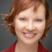 Smiling woman with short, red hair